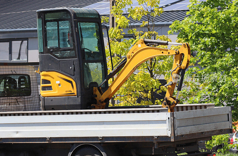 Excavator on a truck city street